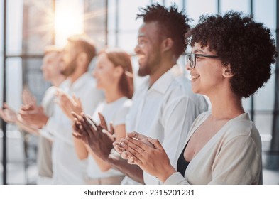 Group of businesspeople sitting in a line and applauding. - Shutterstock ID 2315201231