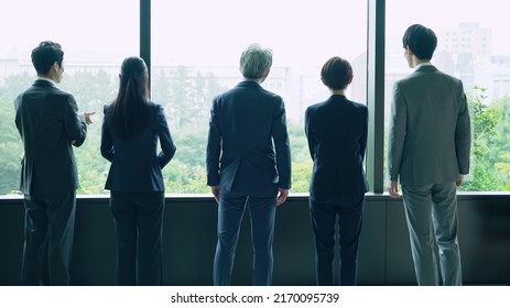 Group Of Businessperson Looking Out From The Office. Business Outlook. Management Strategy.