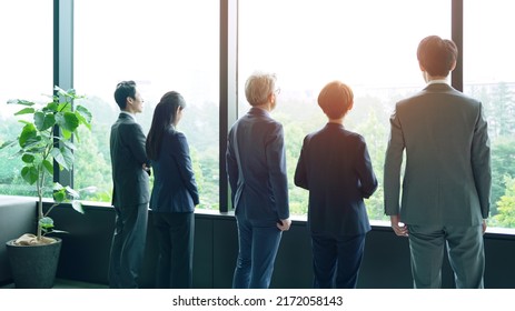 Group Of Businessperson Looking Out From The Office. Business Outlook. Management Strategy.