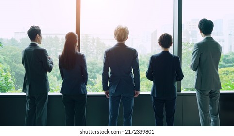 Group Of Businessperson Looking Out From The Office. Business Outlook. Management Strategy.