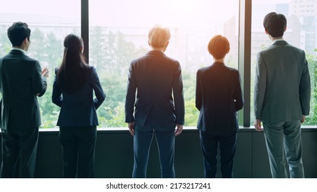 Group Of Businessperson Looking Out From The Office. Business Outlook. Management Strategy.