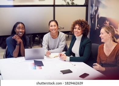 Group Of Businesswomen Collaborating In Creative Meeting Around Table In Modern Office - Shutterstock ID 1829462639