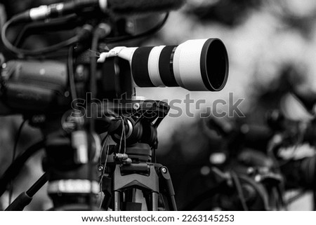 Group of Cameras at an Outdoor Event