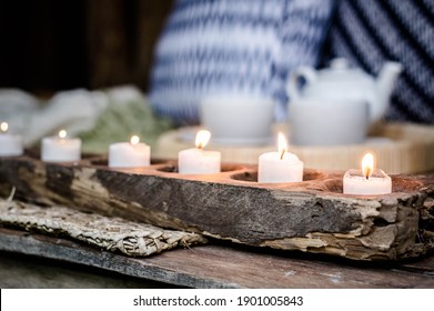 Group Of Candles On A Wooden Candle Holder