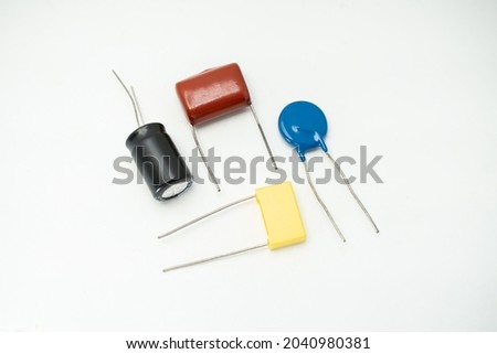 Group of capacitors different sizes isolated on white background. electrolytic capacitors