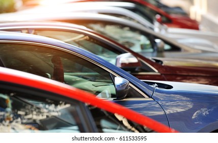 Group of cars parked in a row 