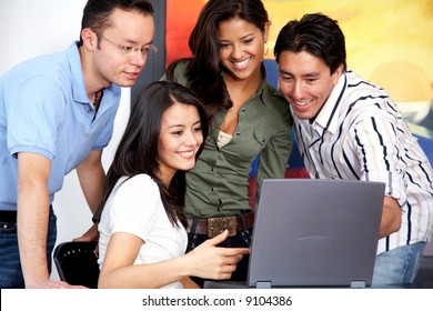 Group Of Casual People On A Computer At Home