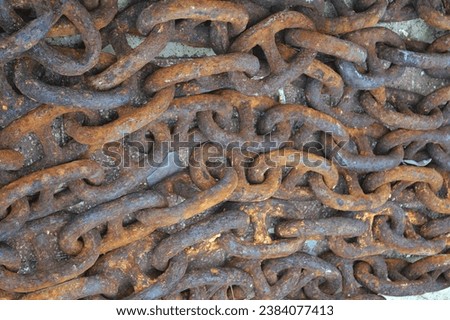 a group of chains rusted by the sea