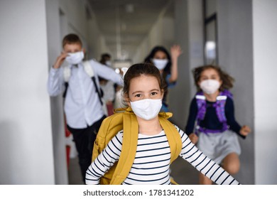 Group Of Cheerful Children Going Home From School After Covid-19 Quarantine And Lockdown.