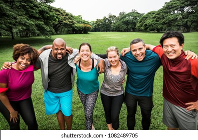 Group of cheerful diverse friends in the park - Powered by Shutterstock