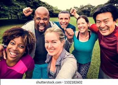 Group Of Cheerful Diverse Friends In The Park