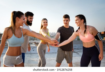 Group Of Cheerful Fit Fitness Team Exercising Together Outdoor