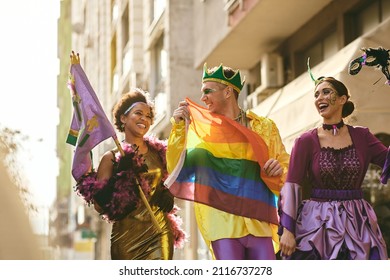 Group Of Cheerful Friends Celebrating Mardi Gras And Having Fun On Street Parade During The Festival.