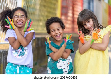 Group Of Cheerful Multicultural Children Showing Painted Hands