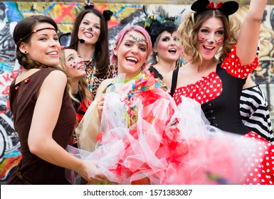 Group Of Cheerful Women In Sexy Costumes At Carnival Party