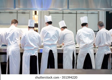 Group Chefs Busy In Commercial Kitchen Of Fine Dinning Restaurant