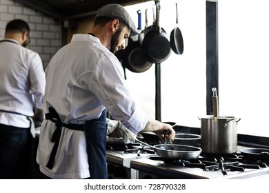 Group of chefs working in the kitchen