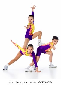 Group Of Children Acrobats.sporting Exercise.image Of Athletes On A White Background.