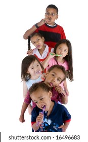 A Group Of Children Brushing Thier Teeth.