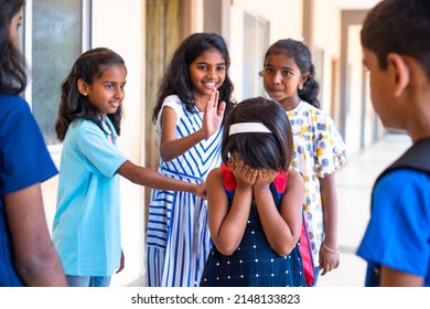 Group Of Children Buylling Girl Kid By Surrounding At School Corridor - Conept Of Ragging, Threatening And Social Rejection