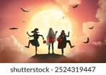 Group of children in carnival costumes at Halloween. Kids on moon sky background.