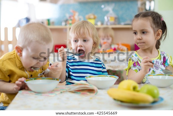 Group Children Eating Plates Day Care Stock Photo (Edit Now) 425545669