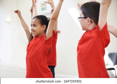 Group Of Children Enjoying Dance Class Together