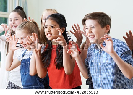 Group Of Children Enjoying Drama Club Together