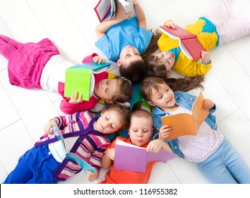 Group of children enjoying reading together