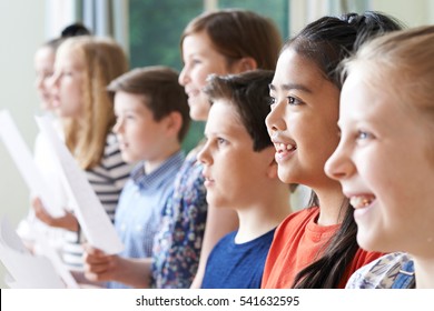 Group Of Children Enjoying Singing Group