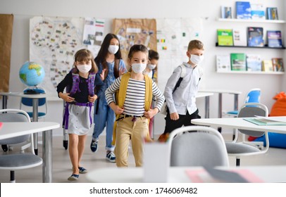 Group of children with face mask back at school after covid-19 quarantine and lockdown. - Shutterstock ID 1746069482