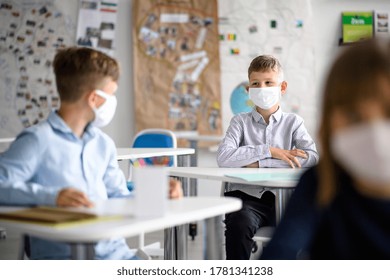 Group Of Children With Face Mask Back At School After Covid-19 Quarantine And Lockdown.