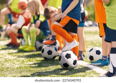 Group of Children With Football Soccer Balls at Training Class. Outdoor Football Training For Little School Kids. Boys and Girls Having Fun at Sports Practice on Summer Day - Powered by Shutterstock