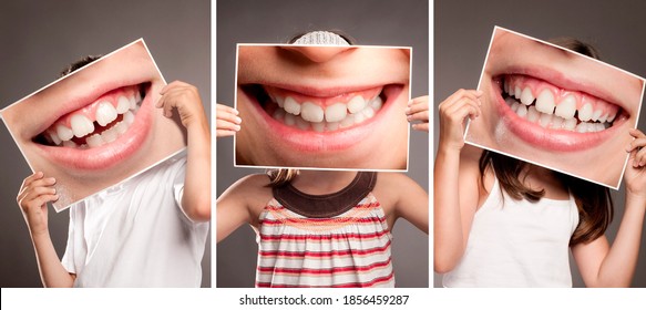 grupo de niños sosteniendo una foto de la boca sonriendo mostrando sus dientes. Concepto de dentista