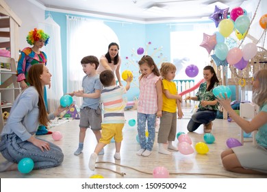 Group of children and parents celebrate birthday party fun together - Powered by Shutterstock