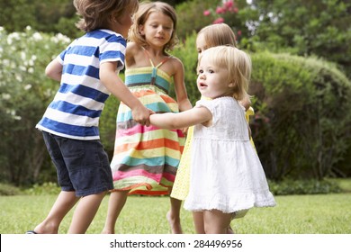 Group Of Children Playing Outdoors Together