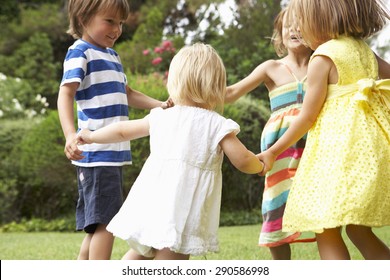 Group Of Children Playing Outdoors Together