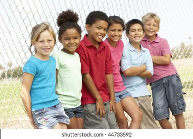 Group Of Children Playing In Park