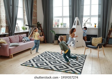 Group Of Children Running Around The Room And Playing Together In The Room