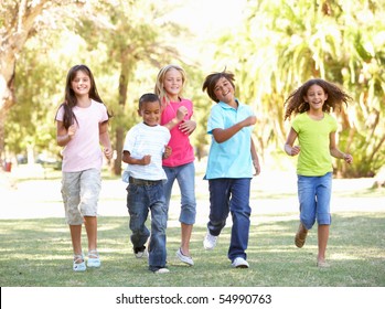 Group Of Children Running Through Park