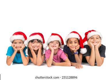 Group of children with Santa's hat posing isolated in white - Powered by Shutterstock