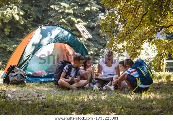 Group Children Sitting On Grass Forest Stock Photo 1933223081 ...