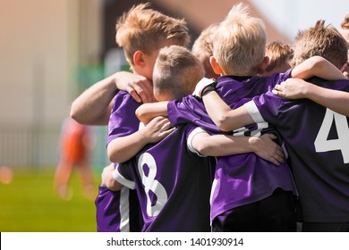 Group Of Children In Soccer Football Team Standing Together Before The Final Game. Boys Motivating Each Other And Building Sports Team Spirit