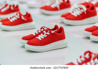 Group Of Children Sports Shoes In The Store.