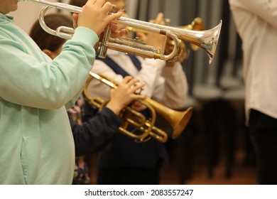 Group Of Children Students Of Music College Players Young Musicians Standing Playing A Musical Instrument Trumpet At A Jazz Band Class