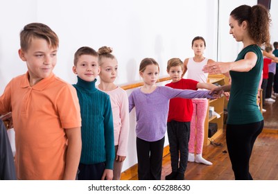 Group of children studying ballet in dance studio