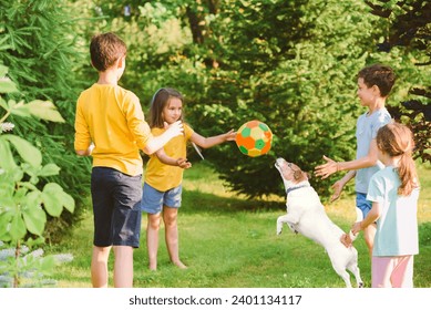 Group of children throw and catch a ball while playing "Monkey in the Middle" game with a dog - Powered by Shutterstock