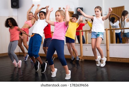 Group Of Children Training In Class, Learning Dance Movements