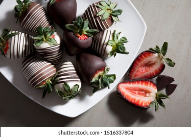 Group Of Chocolate Covered Strawberries On White Plate And Light Background, Sliced Chocolate Covered Strawberry, Valentines Day Dessert, Romantic, Food Gift