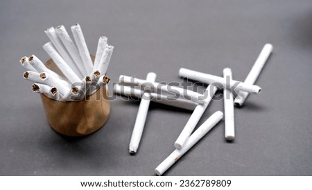 Group of cigarettes in glass jar on black background.Stop smoking. The concept of smoking kills. Smoking as a deadly habit, nicotine poison, cancer and smoking diseases